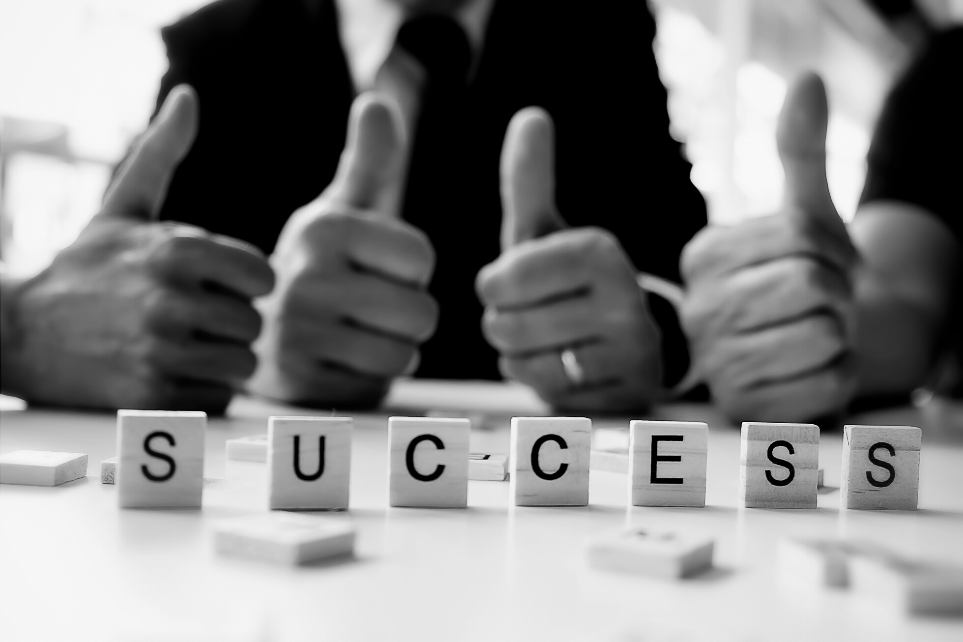 Success Word on Business Working Table. Wooden Cross Word 